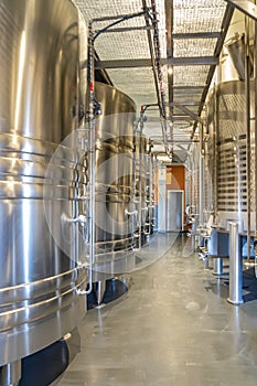 Large steel vats for fermentation of wine in a bodega near Valencia, Spain