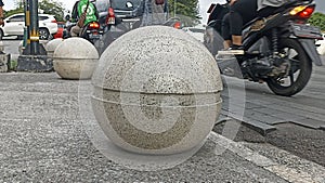 large stone ball on the sidewalk in Titik Nol Kilometer area of ??Yogyakarta City