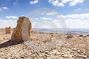 Large stone blocks chaotically standing in a park of stones in the Judean Desert near the city of Mitzpe Ramon in Israel