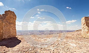 Large stone blocks chaotically standing in a park of stones in the Judean Desert near the city of Mitzpe Ramon in Israel