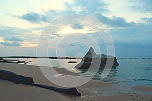 A Large Stone in Calm Sea Waters at Pristine Sandy Beach with Colors in Morning Cloudy Sky - Sitapur, Neil Island, Andaman, India