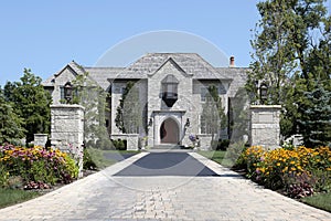 Large stone home with pillars