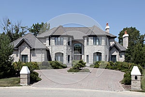 Large stone home with pillars