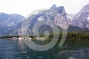 Large stone mountains in the Alps on Konigssee Lake