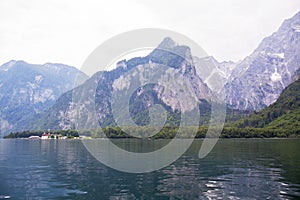 Large stone mountains in the Alps on Konigssee Lake