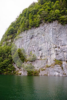 Large stone mountains in the Alps on KÃ¶nigssee Lake