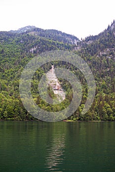 Large stone mountains in the Alps on KÃ¶nigssee Lake