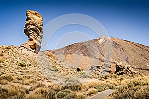 Large stone rock formation. Scenic hiking trail. Mountain landscape with volcano and famous rock. Landmark stone. Roques de Garcia