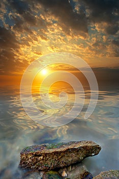 Large stone, sea, sunset