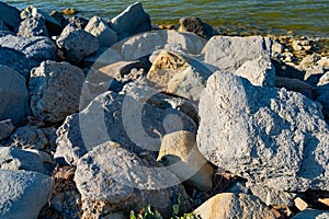 Stones on beach. inconvenient entrance to water