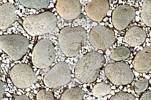 Large stones and fine white gravel for paving