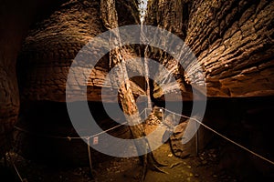 Large stones that resemble snake scales. This is Naka Cave, Bueng Kan Province.