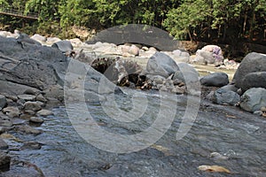 Large stones in the river in West Java in Indonesia