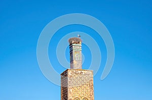 A large stork\'s nest on top of a 13th century mosque minaret in Rabat, Morocco.