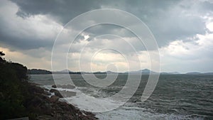 Large storm waves crashing on rocks in slow motion