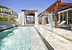 A large swimming backyard pool in modern house