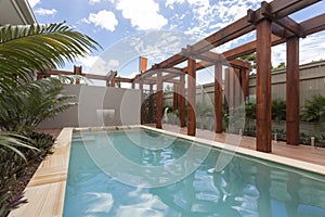 A large swimming pool at modern house backyard