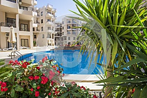 Swimming pool in a luxury tropical apartment resort