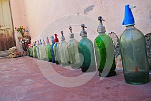 Large syphon collection by the wall