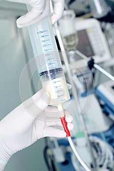 Large syringe in the hands of the healthcare worker