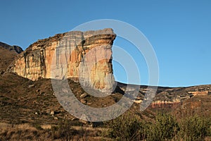 large tall cliff with sunlight on it Brandwag Buttress sandstone cliff Golden Gate Highlands National Park South Africa