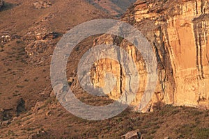 large tall cliff with sunlight on it Brandwag Buttress sandstone cliff Golden Gate Highlands National Park South Africa