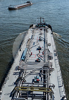 A large tanker ship sailing in Germany on the Rhine River. Transportation of oil, gas and gasoline