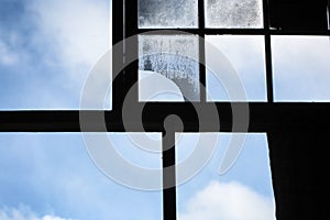 Large timber window frames in an abandoned shearing shed