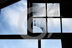 Large timber window frames in an abandoned shearing shed