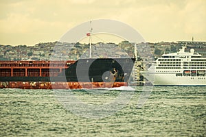 large tonnage ships navigating the strait.. of the Bosphorus, in the background