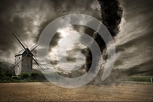 Large tornado over a wind mill