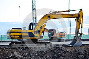 Large tracked excavator on a construction site. Road repair, asphalt replacement.