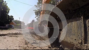 Large Tracked Excavator Digging at Construction Site