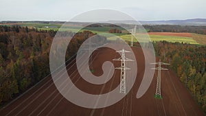 Large transmission towers in countryside. Electricity pylons with steel wires