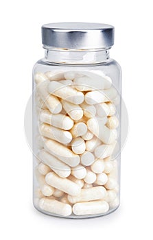 Large transparent gelatin capsules with powder in transparent plastic bottle