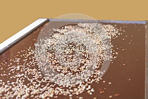 Large tray of fudge with chopped nuts