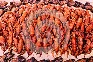 A large tray with red crawfish