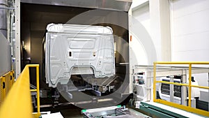 Large truck cab. Scene. Preparation of the truck body for painting in a different color.