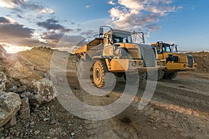 Large trucks in an open pit mine