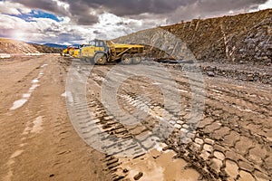 Large trucks in an open pit mine