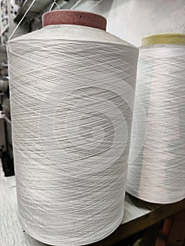 A large tube of cotton used to orlock the seams of garments