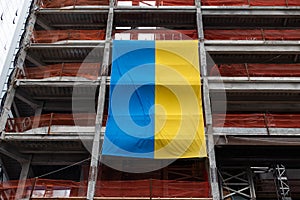 Large Ukrainian Flag on the Side of a Skyscraper Under Construction in Midtown Manhattan of New York City