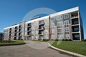 Large Utilitarian Style Gray Apartment Building