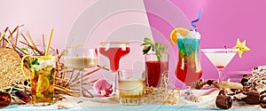 Large variety of exotic summer cocktails on sand