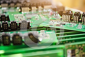 Large Variety of Just Produced Automotive Printed Circuit Boards with Surface Mounted Components with PCBs On Top of Boards.