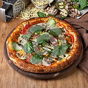 Large vegeterian pizza with sauces and pepper