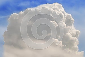 A large vertical cloud against the blue sky. Lonely giant Cumulus cloud