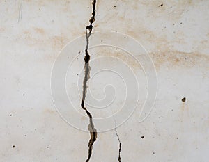 Large vertical crack in plastered wall