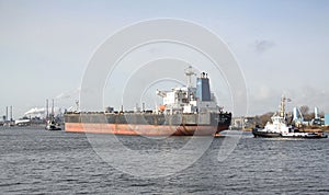 Large vessel being towed into IJmuiden