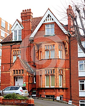 Handsome red brick building with elaborate details.